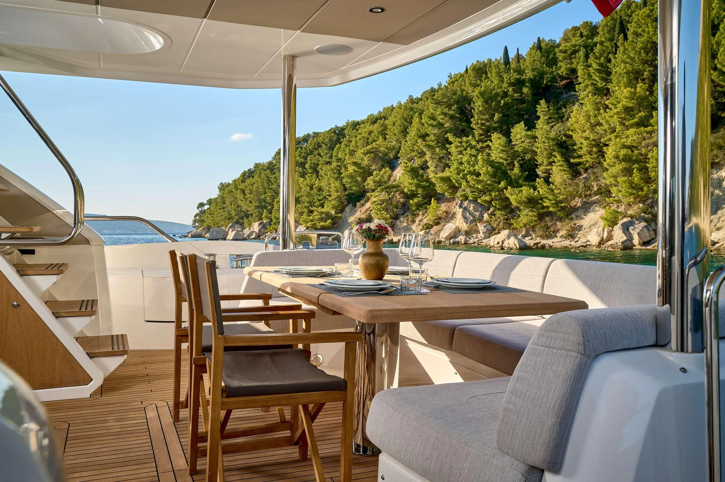 a table and chairs on a deck aboard HIDEAWAY Yacht for Charter