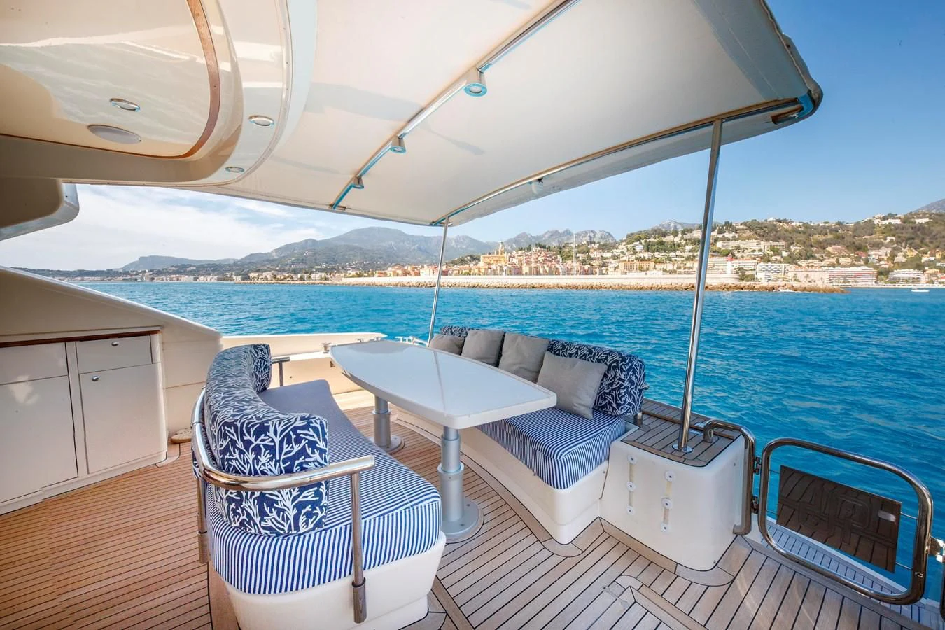 a lounge chair on a deck overlooking a large body of water aboard TRUE AUSTRIAN Yacht for Sale