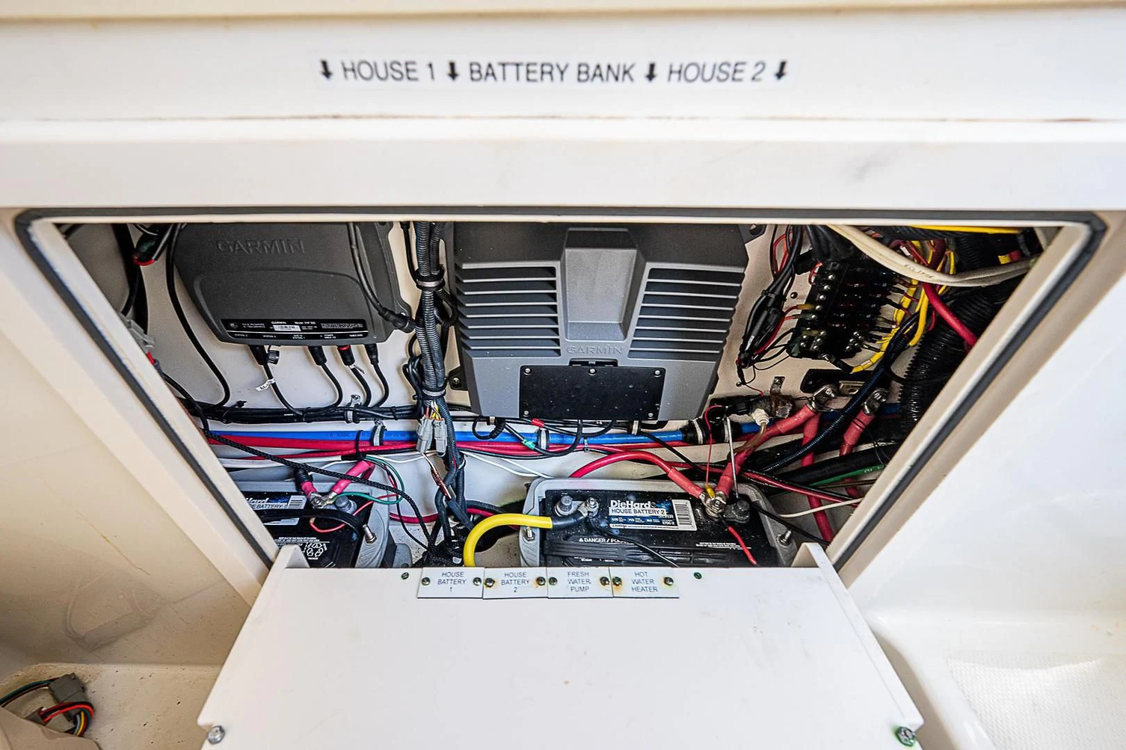 a computer with wires and cables aboard S3XY Yacht for Sale