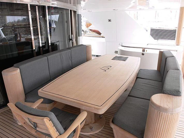 a table with chairs around it aboard LADY IN BLUE Yacht for Sale