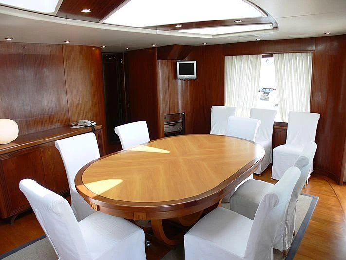 a conference room with a table and chairs aboard LADY IN BLUE Yacht for Sale