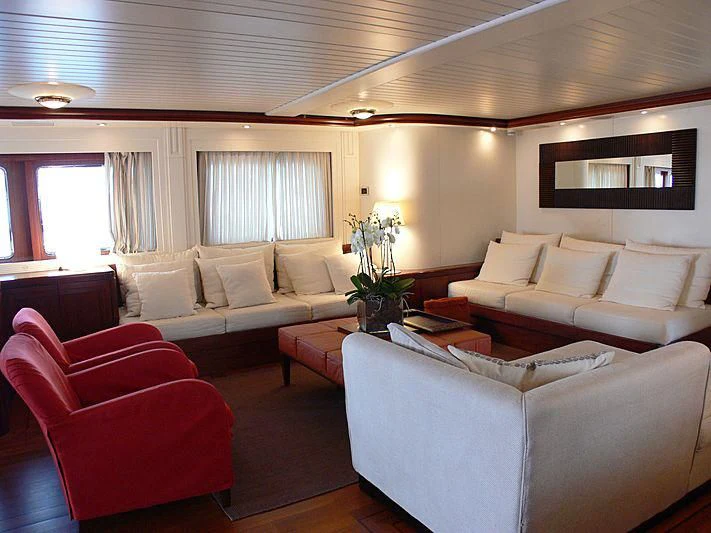 a living room with a couch and a coffee table aboard LADY IN BLUE Yacht for Sale