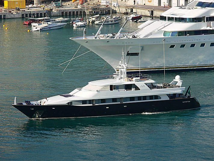 a large white boat in the water aboard LADY IN BLUE Yacht for Sale