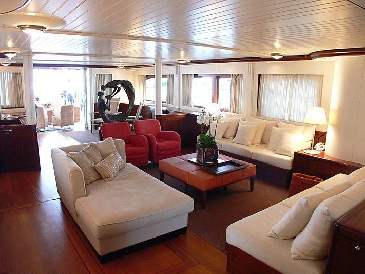 a living room with a large window aboard LADY IN BLUE Yacht for Sale