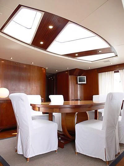 a room with a table and chairs aboard LADY IN BLUE Yacht for Sale