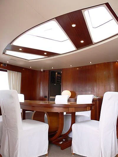 a room with a table and chairs aboard LADY IN BLUE Yacht for Sale