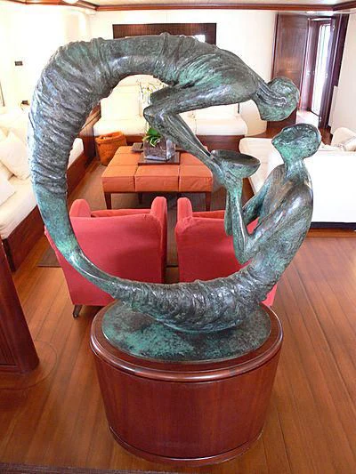 a statue of a person holding a gun aboard LADY IN BLUE Yacht for Sale