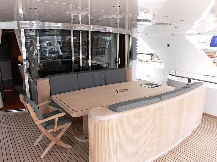a room with a table and chairs aboard LADY IN BLUE Yacht for Sale