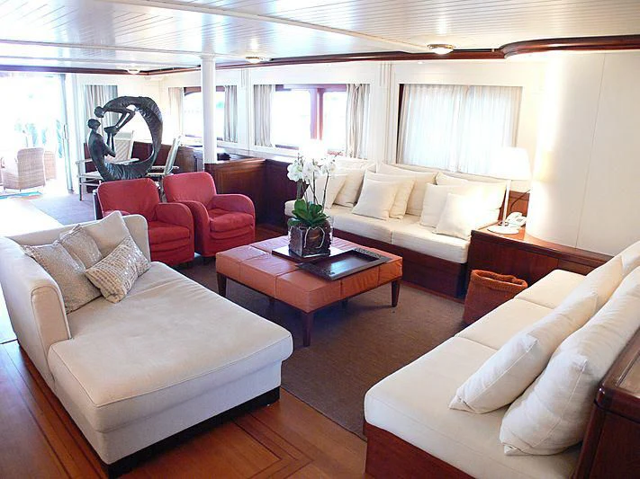 a living room with a couch and a coffee table aboard LADY IN BLUE Yacht for Sale