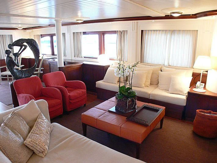 a living room with a couch and a coffee table aboard LADY IN BLUE Yacht for Sale