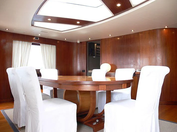 a room with chairs and tables aboard LADY IN BLUE Yacht for Sale