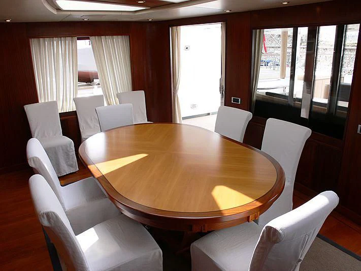 a table with chairs around it aboard LADY IN BLUE Yacht for Sale