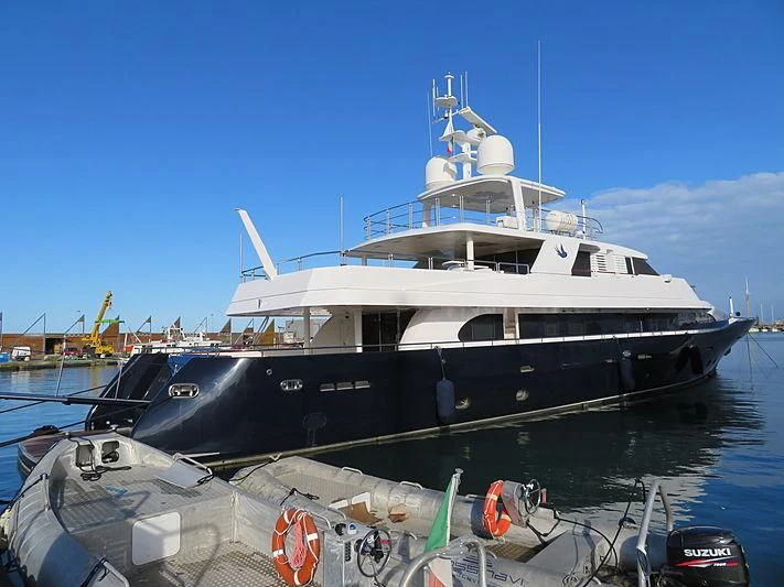 a large white boat on a body of water aboard LADY IN BLUE Yacht for Sale