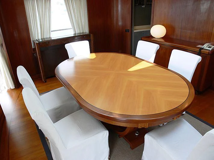 a table with chairs around it aboard LADY IN BLUE Yacht for Sale