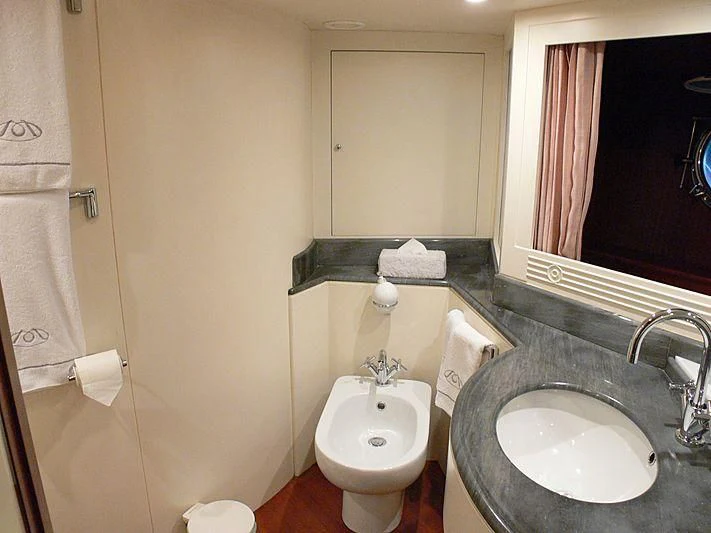 a bathroom with a sink and a mirror aboard LADY IN BLUE Yacht for Sale