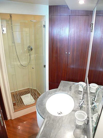 a bathroom with a sink and a shower aboard LADY IN BLUE Yacht for Sale