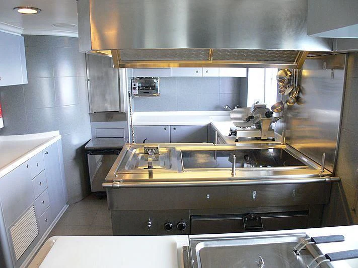 a kitchen with a sink and cabinets aboard LADY IN BLUE Yacht for Sale
