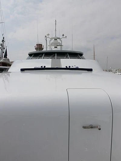 a white boat with a black and white sail on it aboard LADY IN BLUE Yacht for Sale