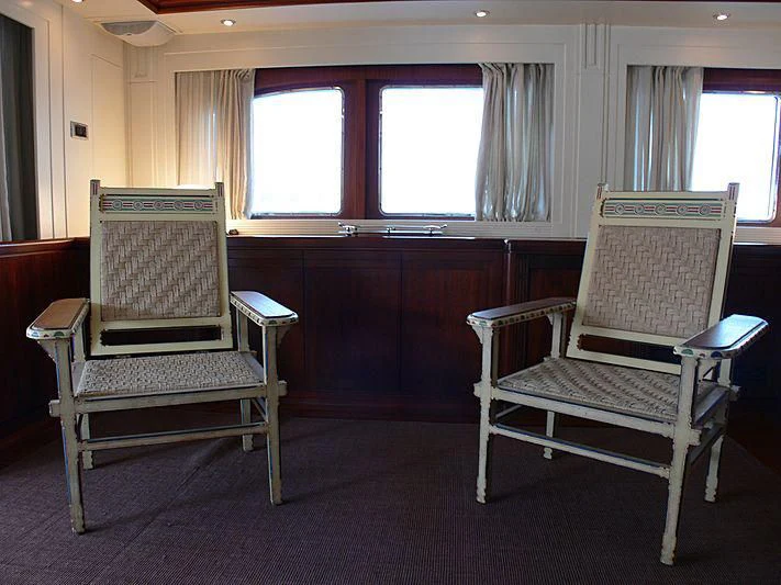 a couple of chairs in a room aboard LADY IN BLUE Yacht for Sale