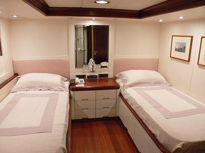 a room with a couple of beds aboard LADY IN BLUE Yacht for Sale