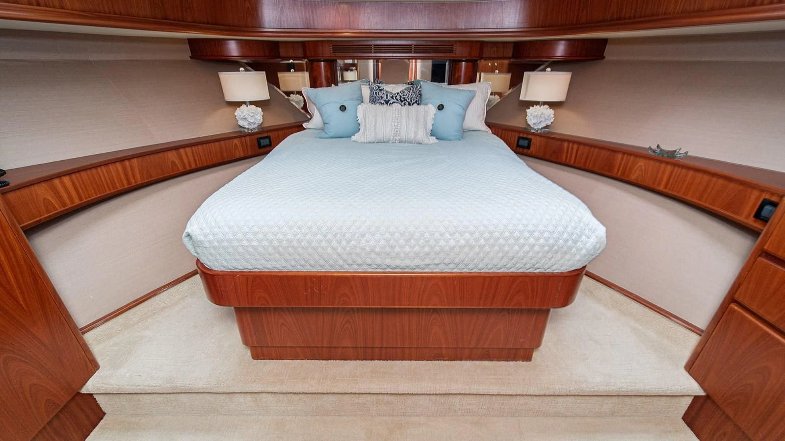 a bed with a white pillow aboard FAN TAIL Yacht for Sale
