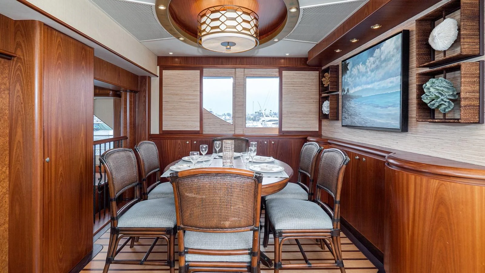 a dining room with a table and chairs aboard FAN TAIL Yacht for Sale