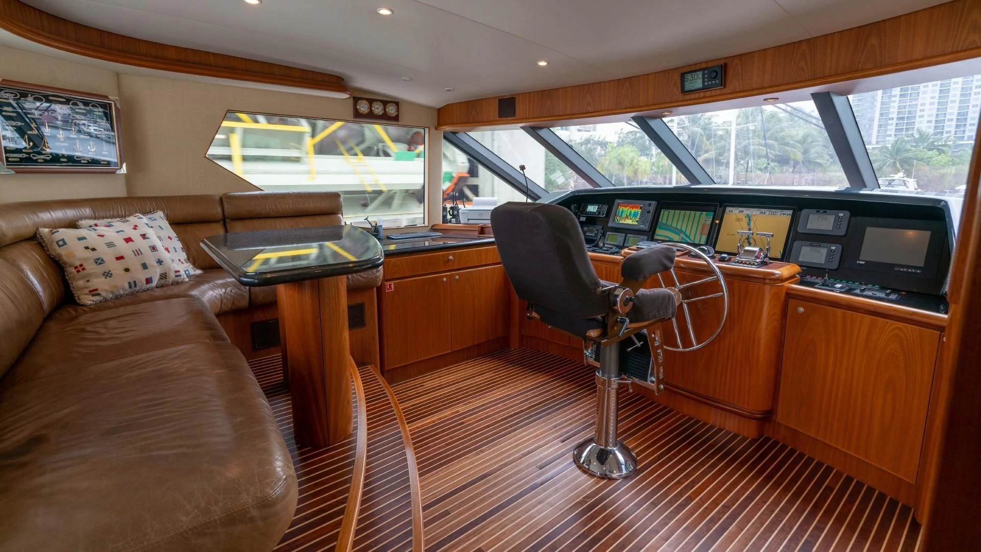 a room with a couch and a table and a chair aboard FAN TAIL Yacht for Sale