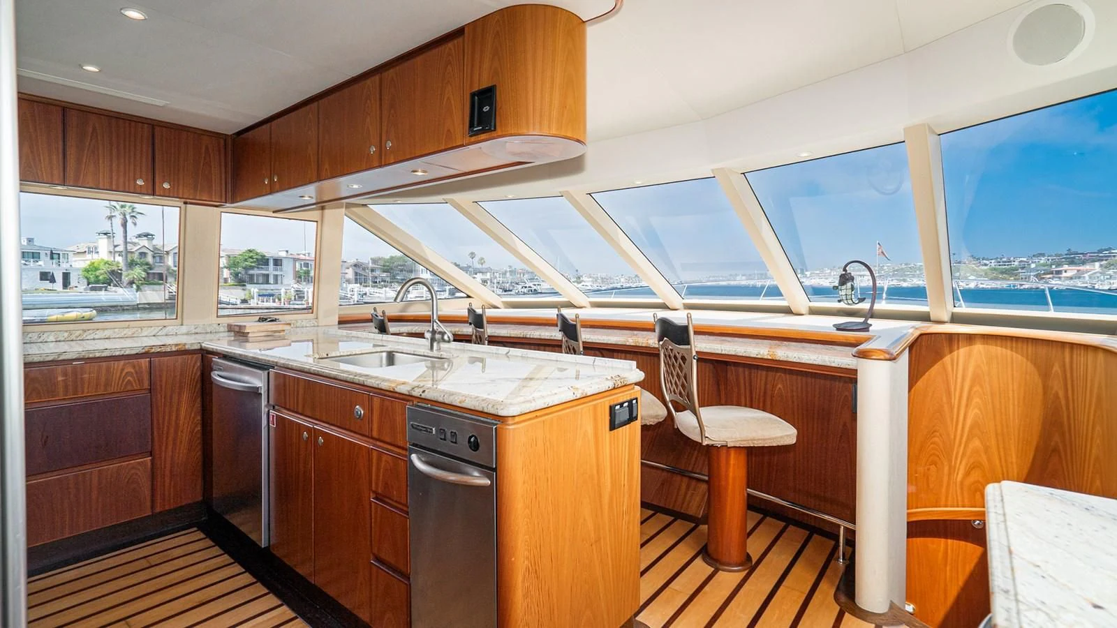 a kitchen with wooden cabinets aboard FAN TAIL Yacht for Sale