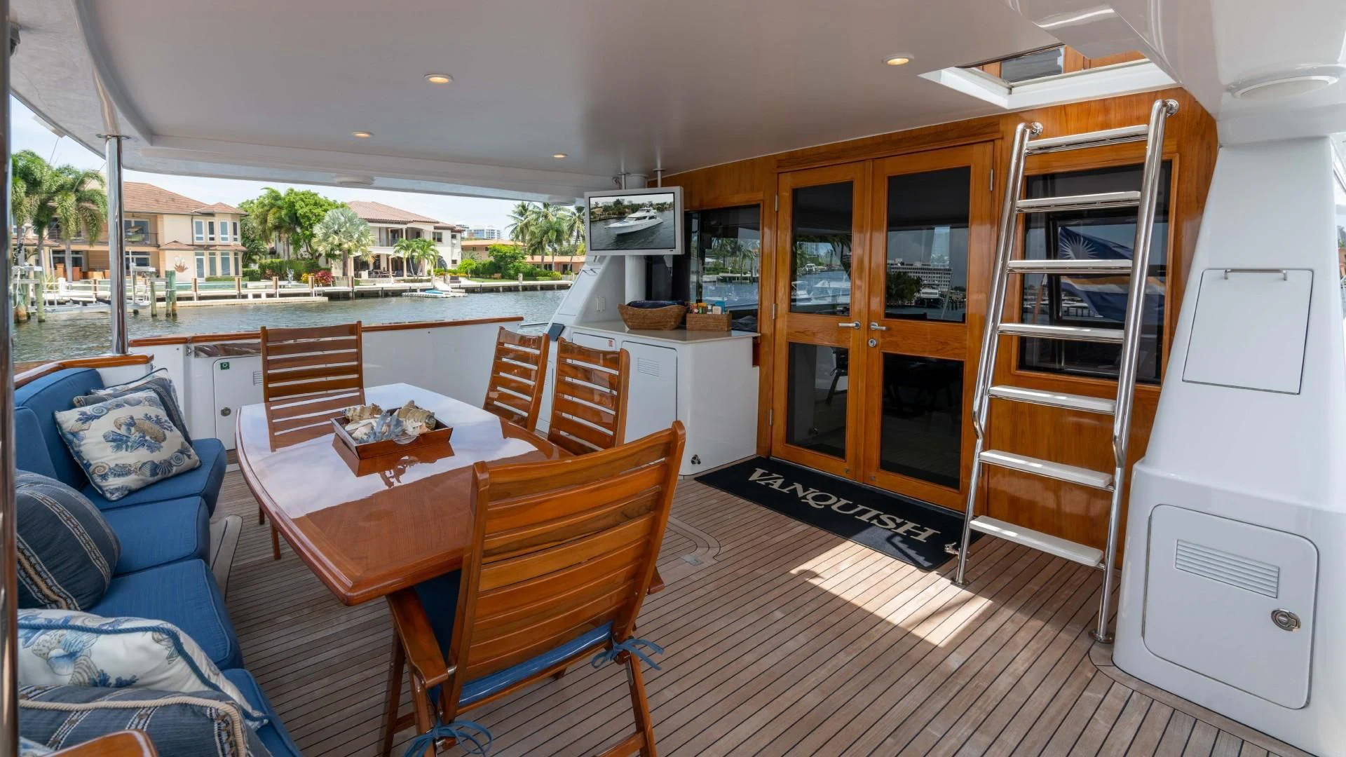 a living room with a table and chairs aboard FAN TAIL Yacht for Sale