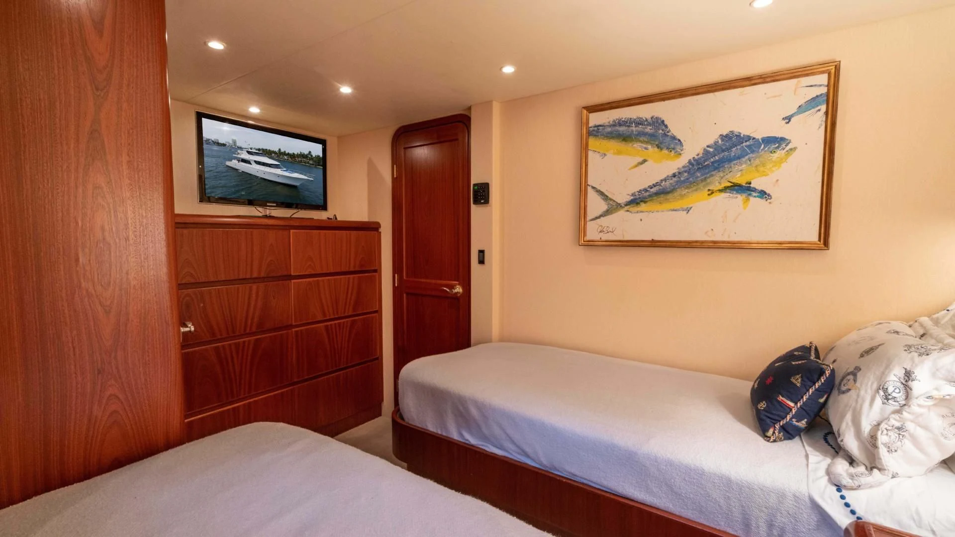 a room with a bed and a dresser aboard FAN TAIL Yacht for Sale