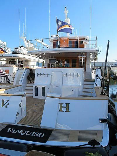 a large white boat with flags on it aboard FAN TAIL Yacht for Sale