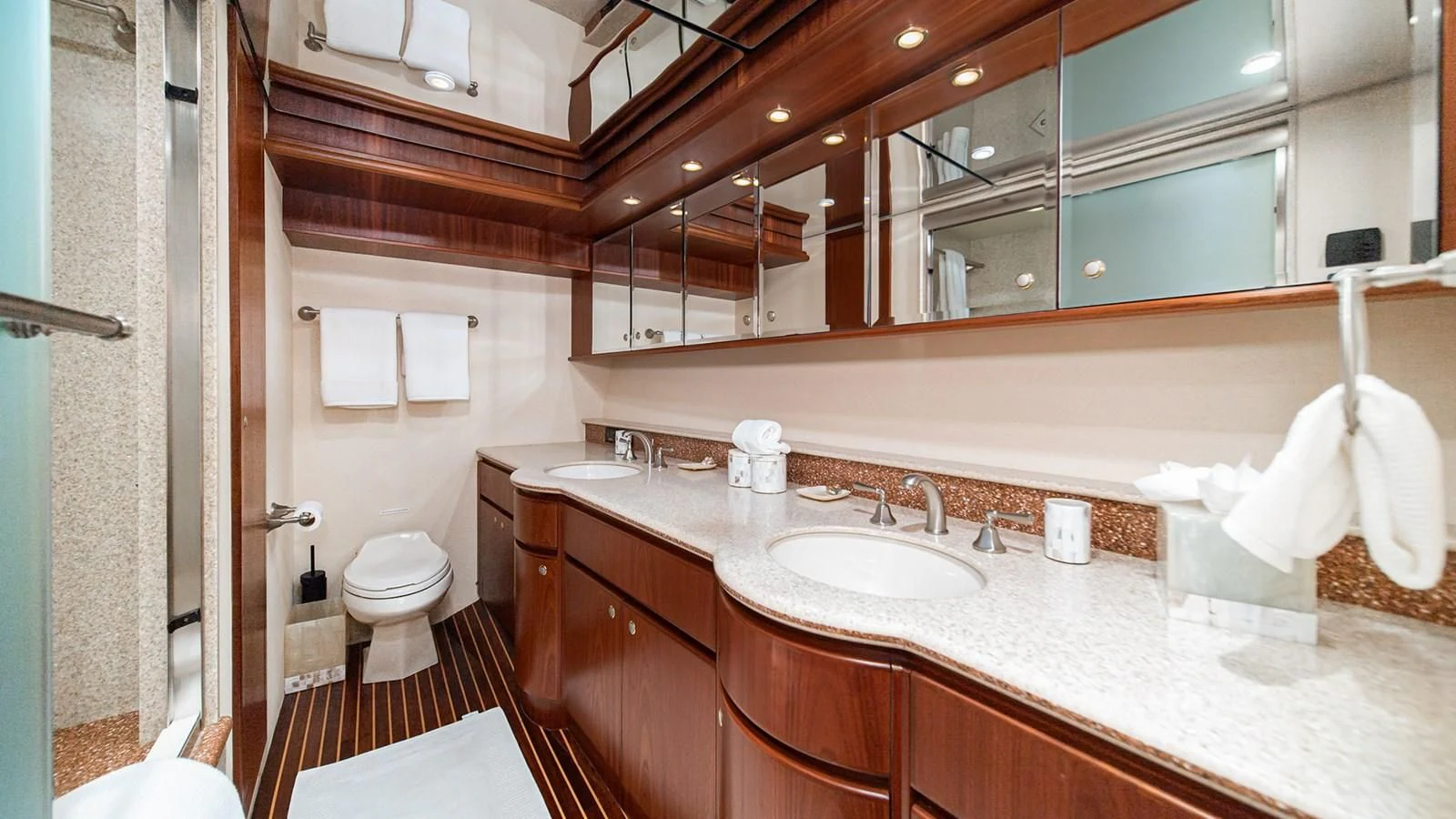 a bathroom with a large mirror aboard FAN TAIL Yacht for Sale