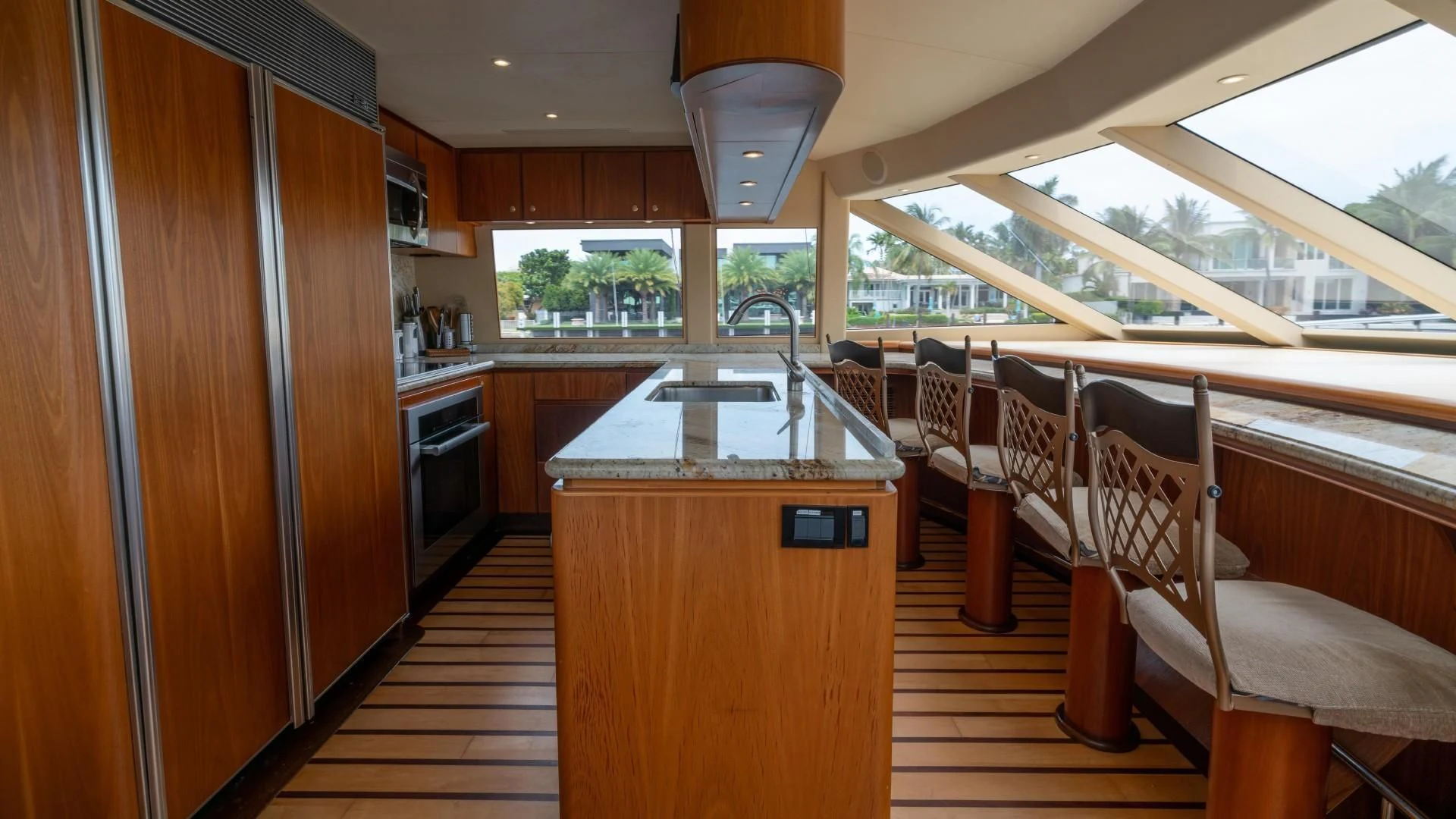 a kitchen with a bar and a bar aboard FAN TAIL Yacht for Sale