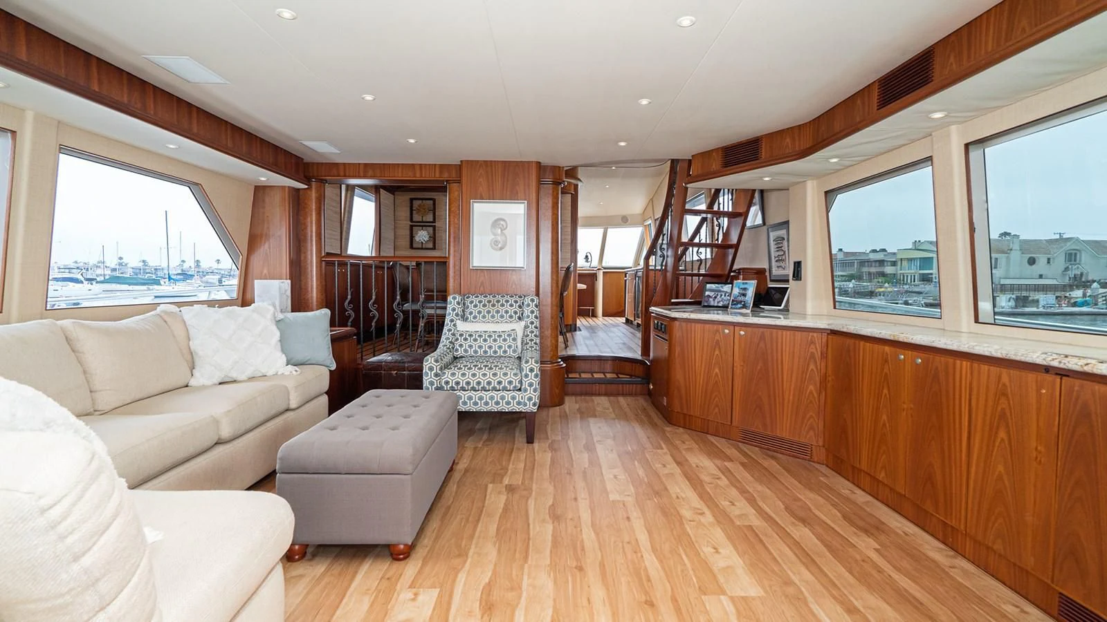 a living room with a wood floor aboard FAN TAIL Yacht for Sale