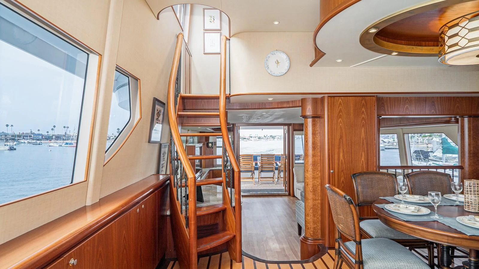 a room with a table chairs and a large screen aboard FAN TAIL Yacht for Sale