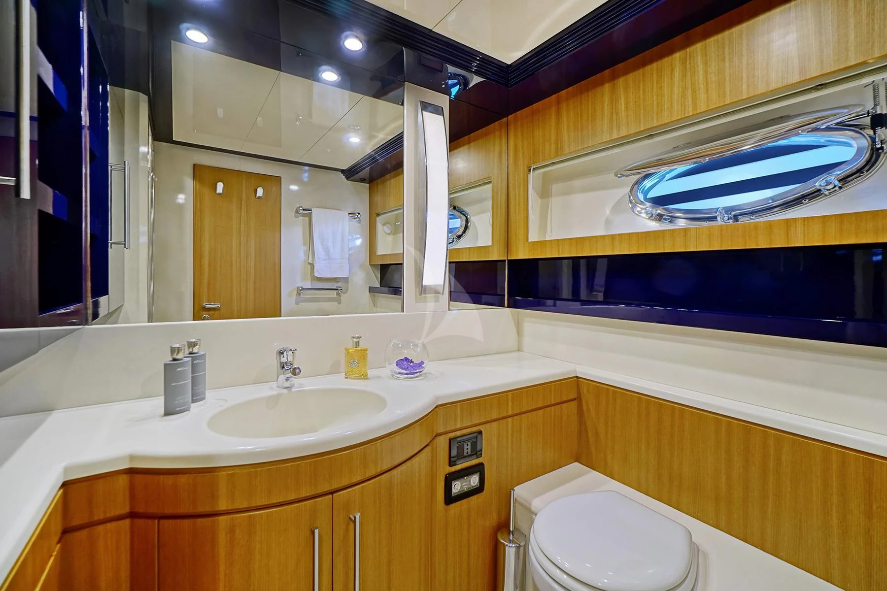 a bathroom with a large mirror aboard SEA U Yacht for Charter