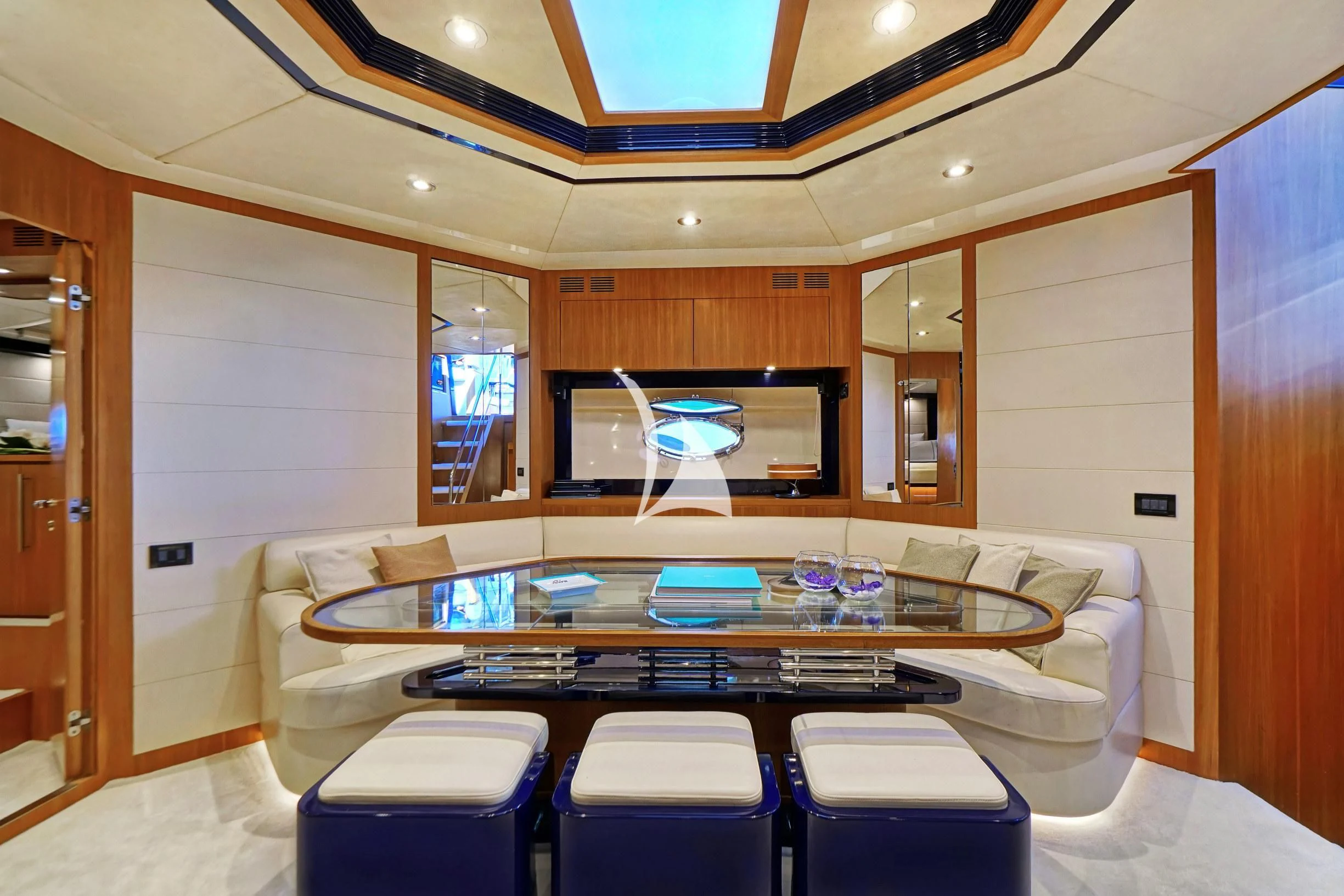 a room with a table and chairs aboard SEA U Yacht for Charter