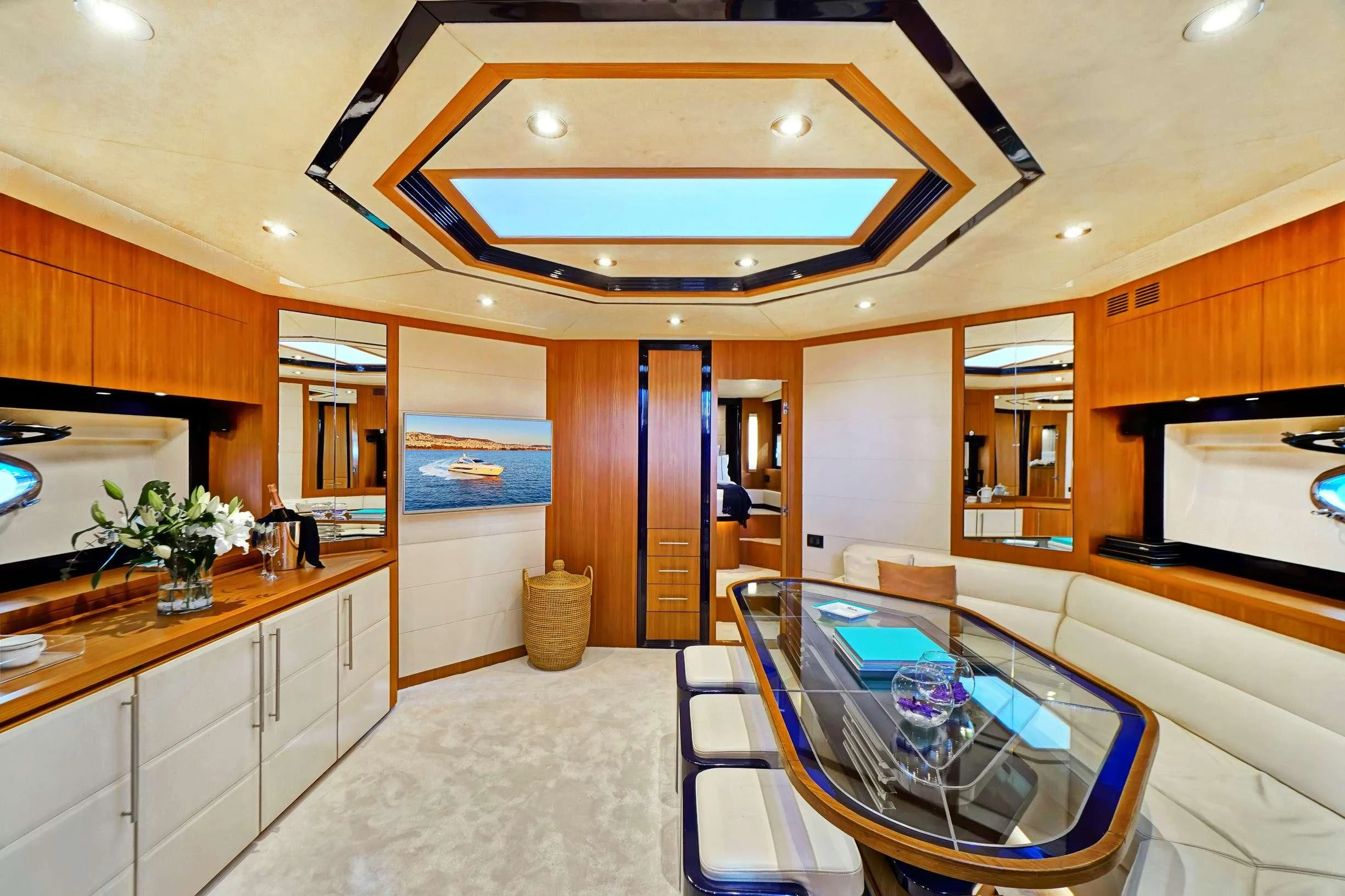 a large kitchen with a large dining area aboard SEA U Yacht for Charter
