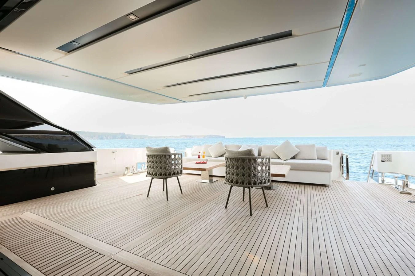 a room with a table and chairs aboard 2022 SANLORENZO SL120A Yacht for Sale
