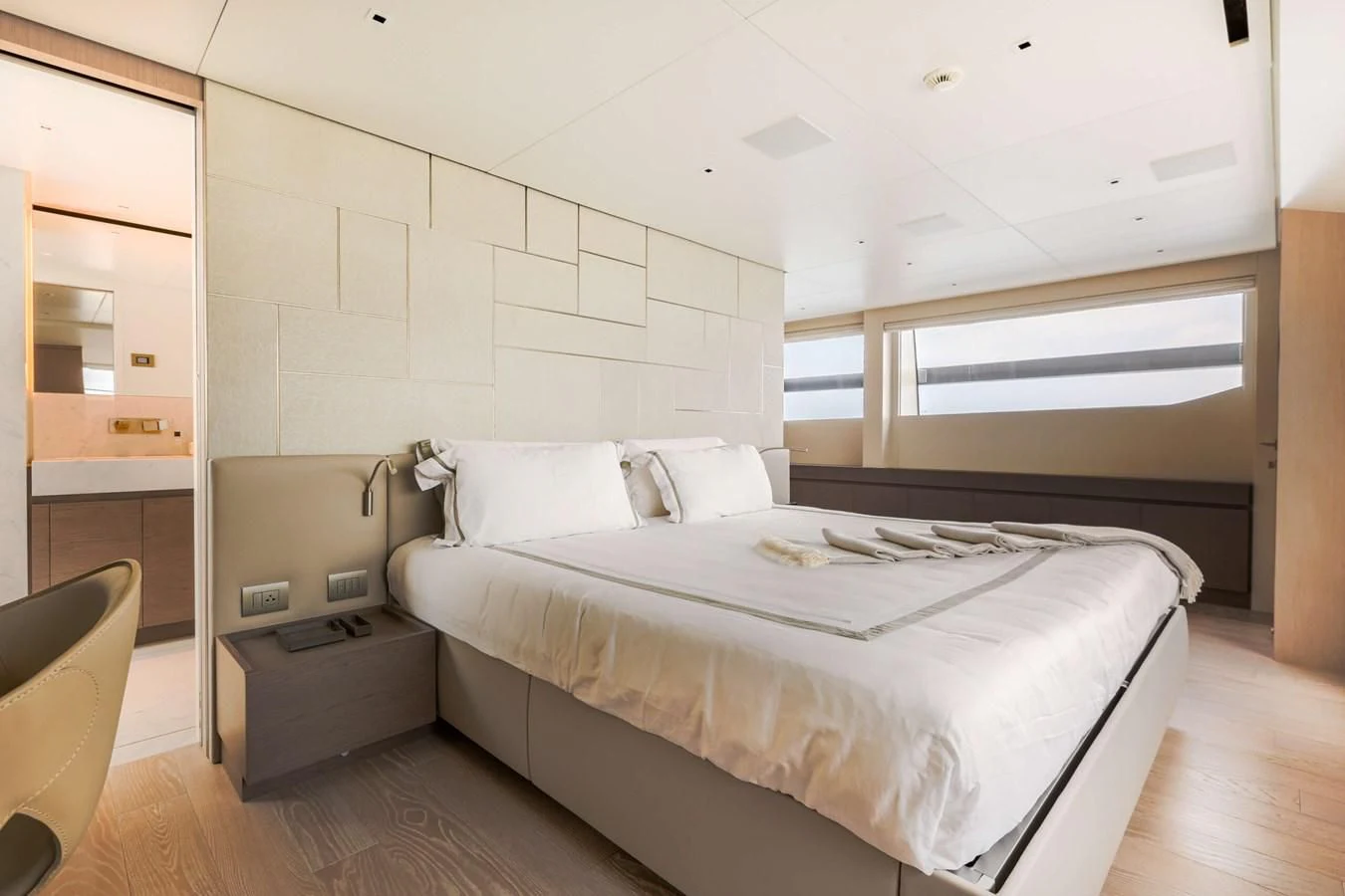 a room with a bed and a chair aboard 2022 SANLORENZO SL120A Yacht for Sale