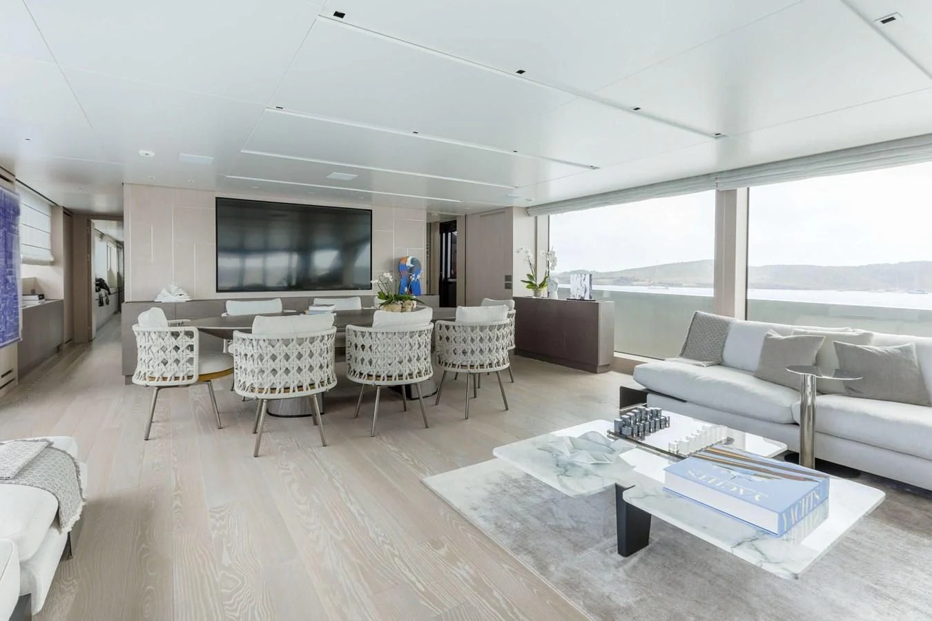 a living room with a large window aboard 2022 SANLORENZO SL120A Yacht for Sale