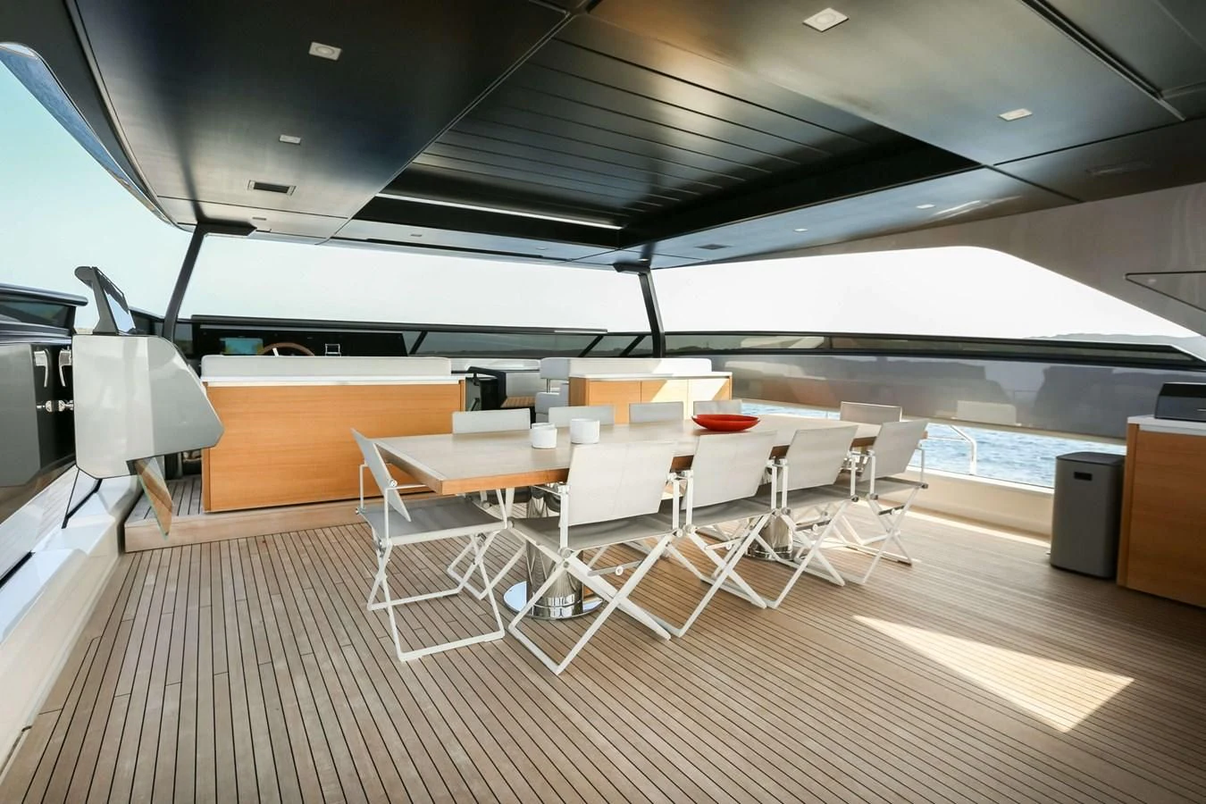 a room with tables and chairs aboard 2022 SANLORENZO SL120A Yacht for Sale