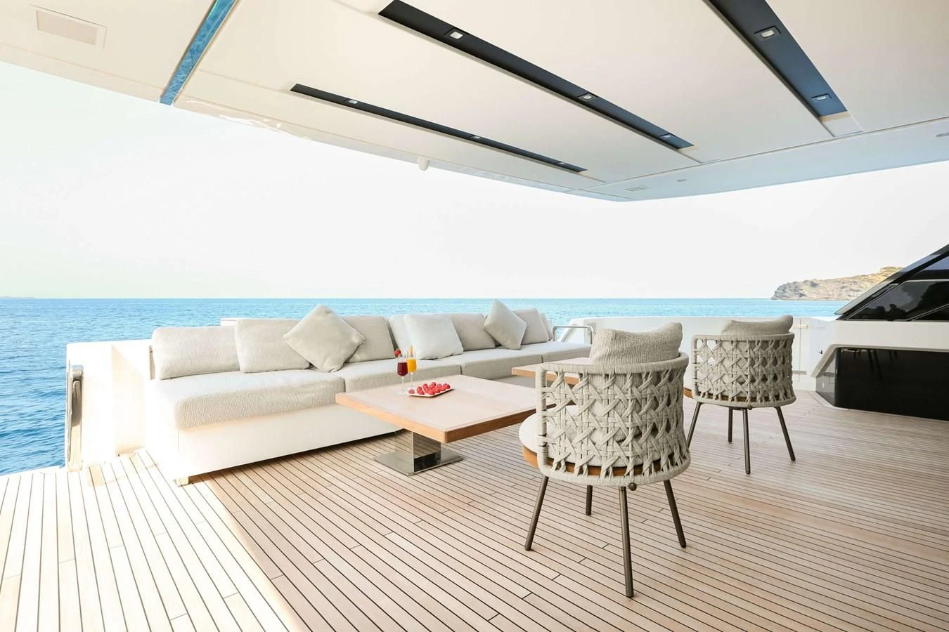 a room with a couch and a table and chairs aboard 2022 SANLORENZO SL120A Yacht for Sale