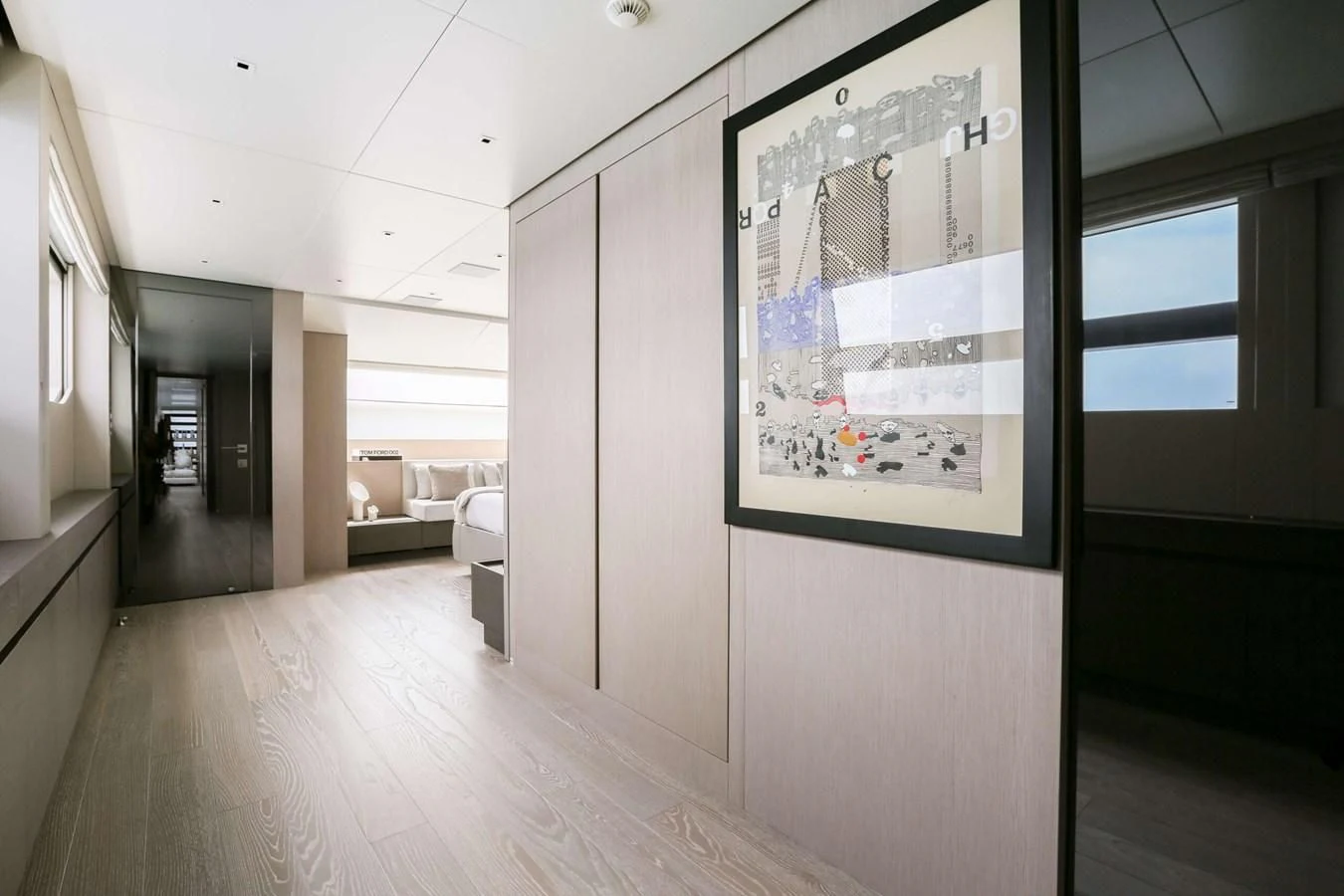 a room with a large poster on the wall aboard 2022 SANLORENZO SL120A Yacht for Sale