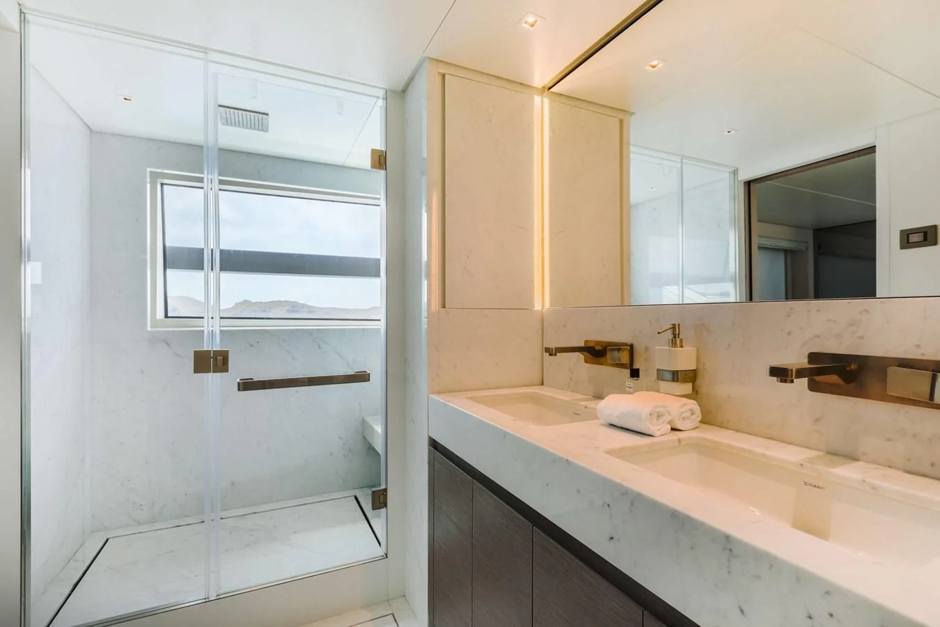 a bathroom with a sink and a mirror aboard 2022 SANLORENZO SL120A Yacht for Sale