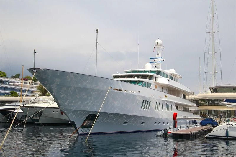 a large white boat in a harbor aboard SIRAN Yacht for Sale