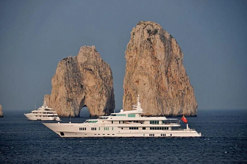 a boat in the water with a large rock formation on top aboard SIRAN Yacht for Sale