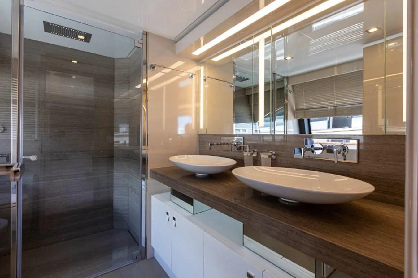 a bathroom with a sink and a shower aboard MIOTU 4 Yacht for Sale