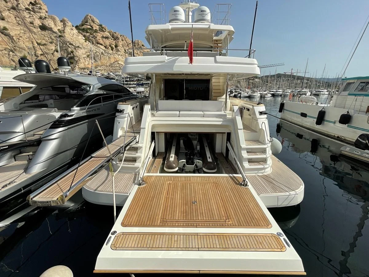 a boat docked in a harbor aboard MIOTU 4 Yacht for Sale