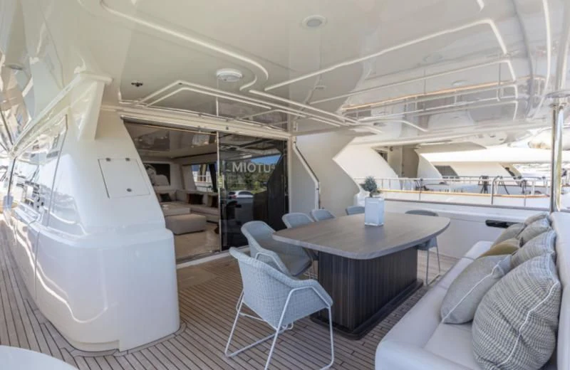 a room with a table and chairs aboard MIOTU 4 Yacht for Sale